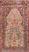 A Kirman prayer rug:, the ivory mihrab with an all over tree of life design,