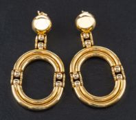A pair of hinged, open, oval drop earrings,: stamped '750', length ca. 4.