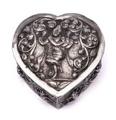 An Indian silver casket and cover: of heart-shaped outline, the domed lid decorated with a dancer,