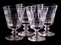 A set of four 19th century glass rummers: with slice and facet cut bucket bowls,