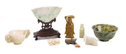 A Chinese jade panel in the shape of a butterfly: mounted on a wood stand, a jade twin handled cup,