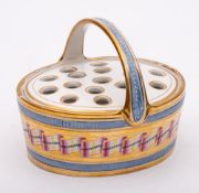 An English porcelain pot pourri basket and pierced cover: of oval form with overhead handle,