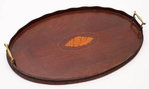 An Edwardian mahogany and marquetry tray: of oval outline with inlaid conch shell medallion,