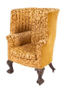 A carved mahogany and Damask upholstered barrel back armchair in George III style, 19th century,
