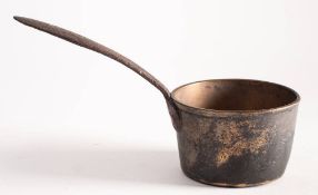 An 18th century bronze saucepan: of tapering cylindrical form with steel flared handle, 24cm long.