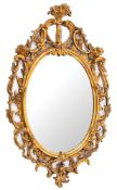 A giltwood and composition framed oval wall mirror in Rococo style, second half 18th century,