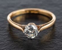 A round, brilliant-cut diamond, single stone ring,: estimated diamond weight ca. 0.