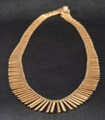 A mid-20th century, fringe necklace,: stamped '750', with Italian control stamps for 1944-1968,