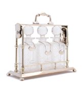 A silver plated three bottle Tantalus, maker Mappin & Webb: of rectangular outline,