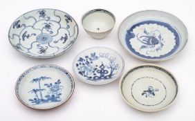A group of Chinese porcelain wreck cargo: comprising a Nanking Cargo saucer painted in blue with