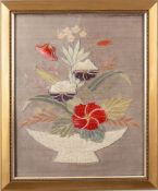 A silk work picture depicting a basket of flowers: framed and glazed, 49 x 39cm.