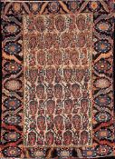 A Melayer rug:, the beige field with an all over design of boteh medallions,