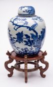 A Chinese porcelain oviform jar and cover: painted in blue with birds amongst peony and pierced