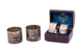 A pair of Victorian silver napkin rings, maker Martin, Hall & Co, Sheffield, 1885: initialled,