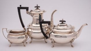 A George V silver three-piece tea and coffee service, maker Walker and Hall, Sheffield,