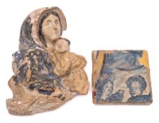A maiolica tile: of square form painted in blue with two heads, probably 16/17th century,
