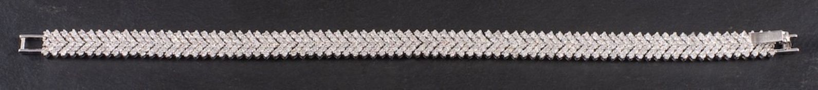 A diamond line bracelet,: the chevron links set throughout with brilliant cut diamonds,