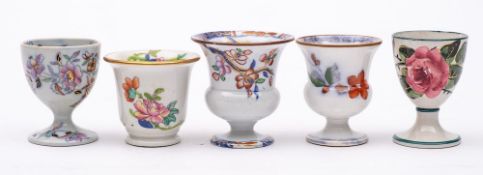 A group of five 19th Century pottery egg cups: including a Wemyss cup painted with pink cabbage