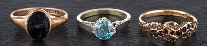 Three rings,: a 15ct gold garnet and seed pearl ring, with hallmarks for Birmingham,