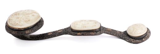A Chinese carved hardwood and hardstone inset ruyi sceptre: of traditional S-shaped outline with