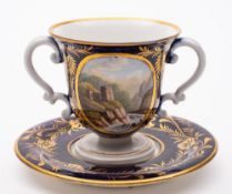 A Derby two-handled cup and stand: with double scroll handles,