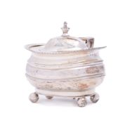 A George III silver mustard pot and cover, maker Solomon Hougham, London, 1814: crested,
