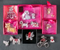 Twelve dog brooches by Butler and Wilson,: set with vari-coloured pastes,