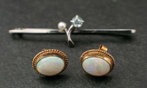A pair of opal ear studs and an aquamarine and cultured pearl bar brooch,: the 9ct gold, oval,