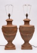 A pair of large contemporary terracotta table lamps: each in the form of a classical urn with