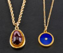 Two locket pendants both set with locks of hair,: including an 18ct gold,