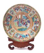 A Chinese Canton famille rose/verte punch bowl: enamelled overall in traditional bright colours