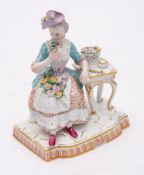 A Meissen figure allegorical of the Sense of Smell from the set of the five Senses: after the