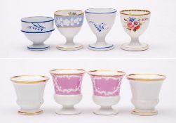 A group of eight Spode & Copeland egg cups: including a pair of Copeland & Garrett 'Felspar' cups