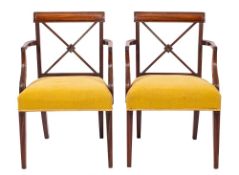 A pair of Regency mahogany and upholstered library elbow chairs, circa 1815,: the square,