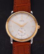 An 18ct gold and steel manual wind Omega wristwatch: the round silvered dial with baton hour