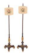 A pair of Regency carved and parcel giltwood pole screens, in the manner of Morel and Seddon,