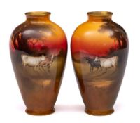 A pair of Royal Doulton vases: of oviform decorated with cattle in a sunset landscape by William