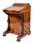 A Victorian walnut and inlaid serpentine fronted Davenport, circa 1870,
