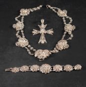 A silver filigree Maltese cross pendant, with filigree chain and associated filigree bracelet,