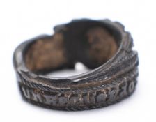 A 18/19th century wooden mourning ring: carved with a hand offering a bouquet and the inscription