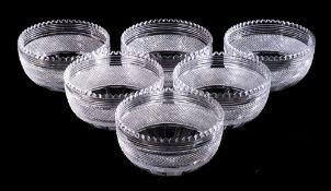 A set of six cut glass finger bowls: of circular form with notched rim and linear,