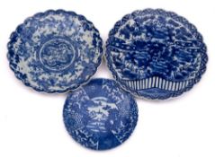 Two Japanese Arita blue and white fluted chargers and a similar plate,