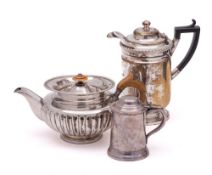 A Sheffield plate teapot: of squat globular form with half-reeded decoration,