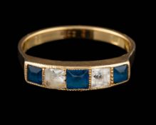 A blue stone and white stone ring,: set with alternating square cut blue and white stones,
