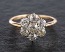 An old-cut diamond cluster ring,: total estimated diamond weight ca. 1.
