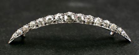 An old and single-cut diamond, crescent brooch,: total estimated diamond weight ca. 1.