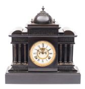 An American black slate mantel clock: the eight-day duration movement striking the hours on a gong,