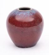 A Chinese porcelain flambé jar: of oviform and glazed with lavender tinged sang de bouef glazes, 7.