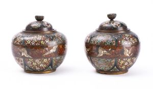 A pair of Japanese cloisonne jars and covers: of squat globular form, with domed lift-off covers,