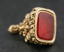 A carnelian seal fob,: the carnelian engraved 'Jane', length ca. 2cm, total weight ca. 4.7gms.